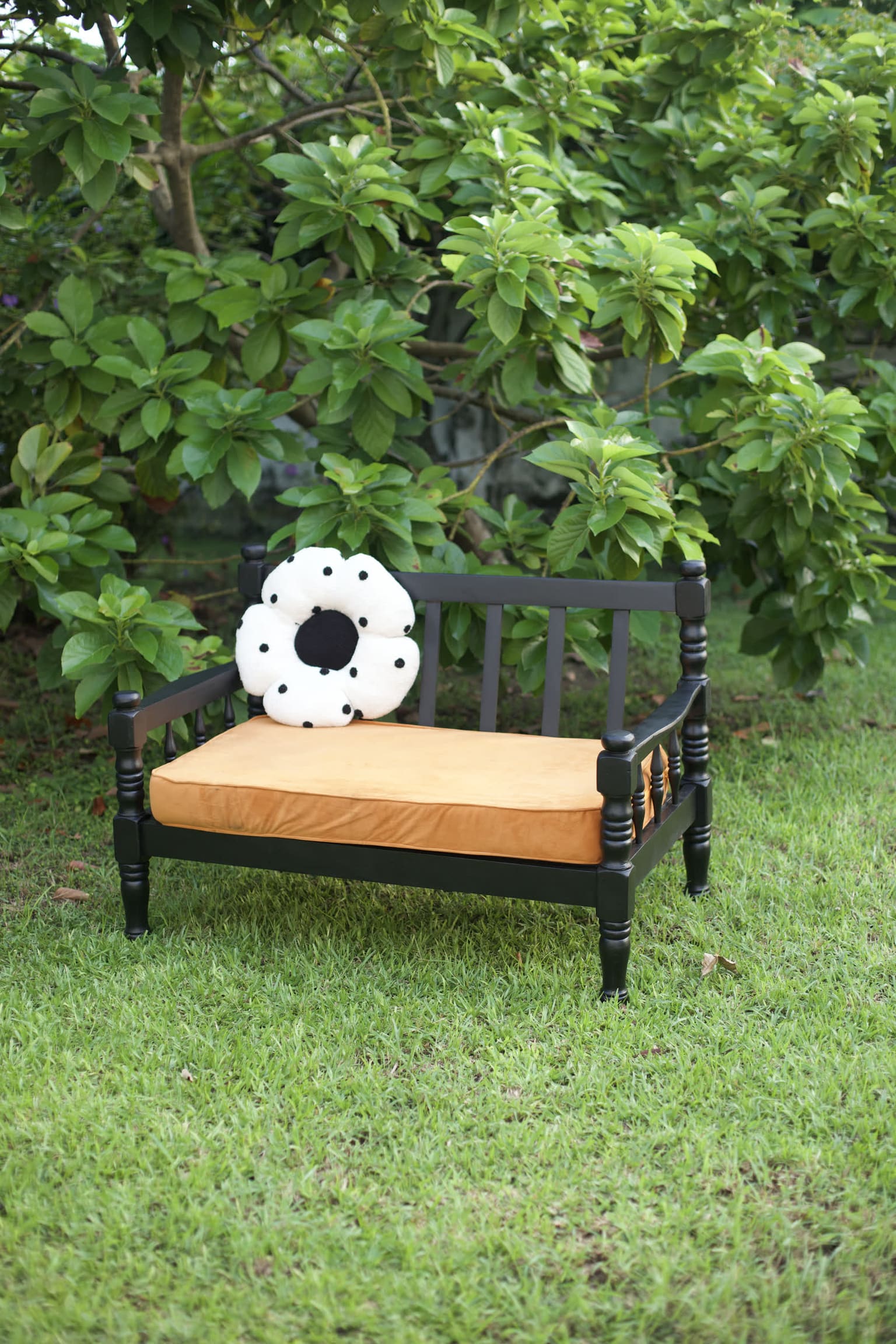The Sankofa Project — restored bench in black lacquer with ochre cushion